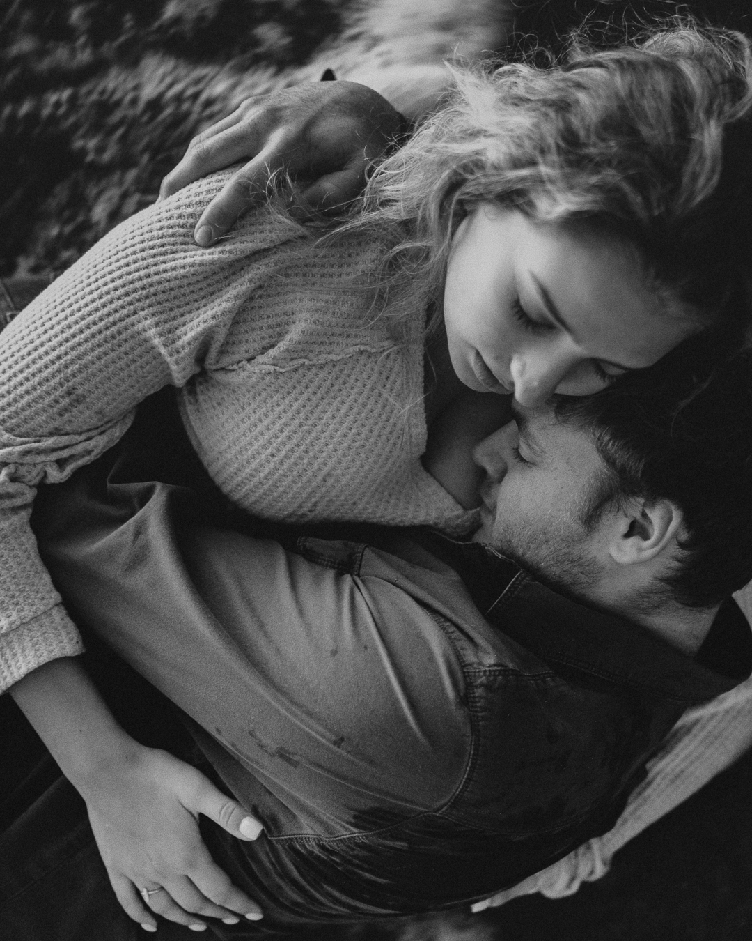 Gabe and Alena holding each other in a close black-and-white portrait